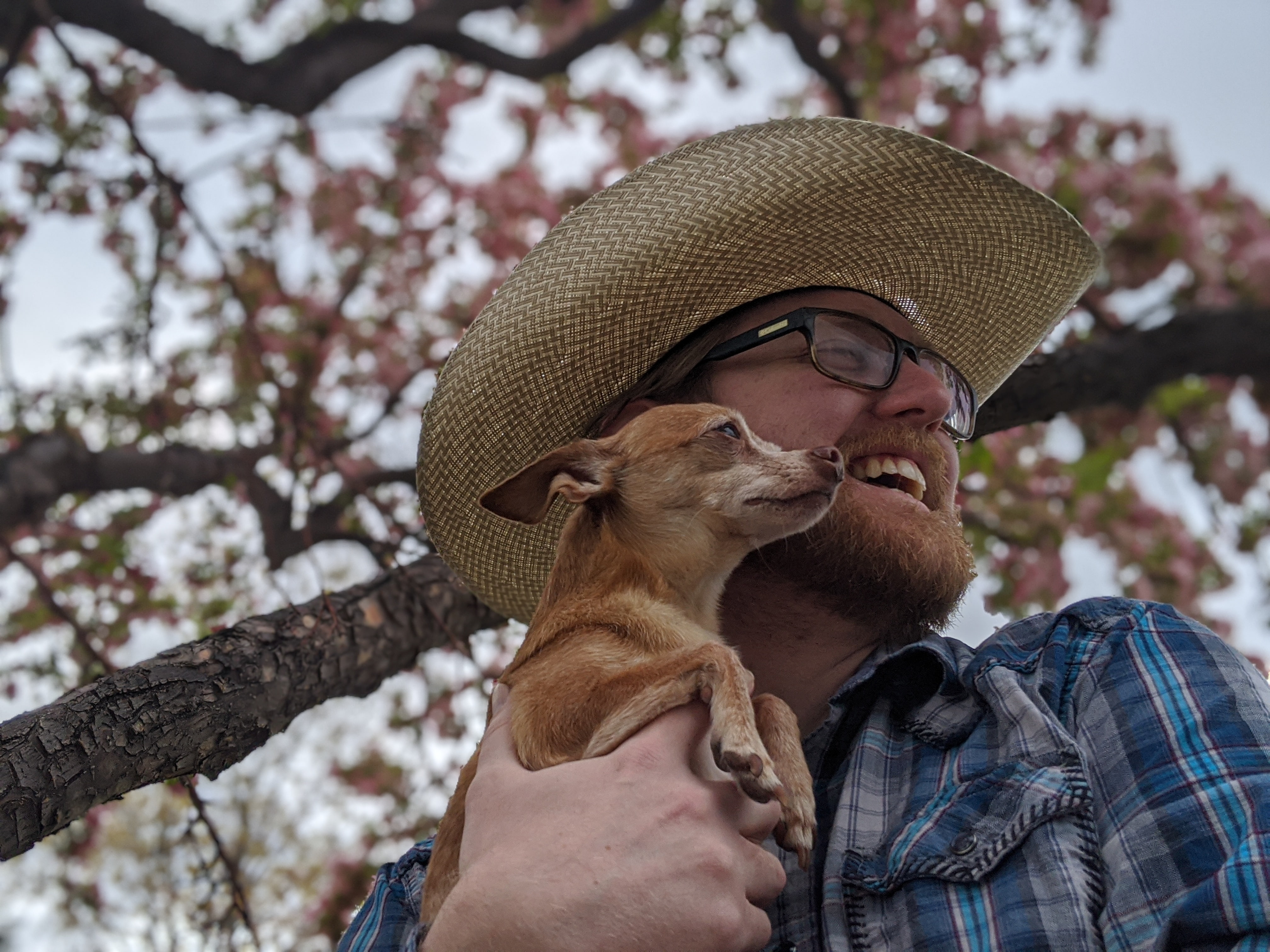 Scott Nelson, Baton Rouge wedding DJ holding his chihuahua, Nikolai